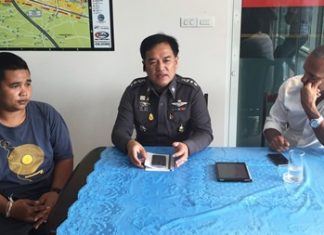 Pol. Col. Supathee Bunkhrong (centre) interrogates jet ski vendor Chawalit Janthong who was arrested for assaulting a Swedish tourist who intervened in the vendor’s alleged extortion of a customer.